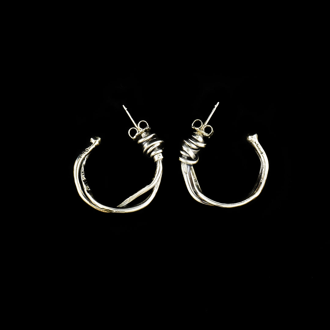 These hoop stud earrings have sterling silver hoops made from coiled wires.