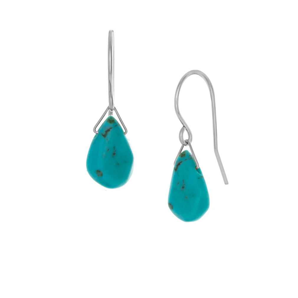 These dangling turquoise earrings have sterling silver hooks and turquoise hangs. The gem hangs are teardrop shaped, have a rustic look and are lantern hung from the hooks.