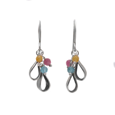 These assorted gemstone earrings have three round and multi-coloured semi-precious gemstones that dangle along with teardrop shaped silver accents.