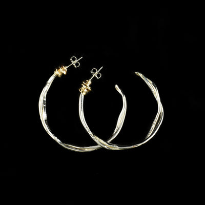 Sterling Silver Twist of Fate Large Hoop Earrings handcrafted by artist Joy Annett.