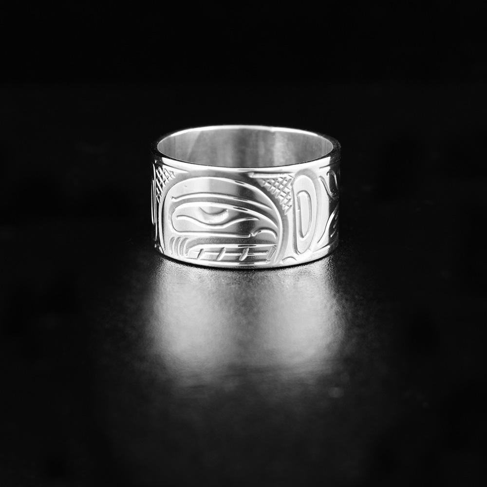This heavy gauge Orca ring is made from sterling silver and has a wide band. There is a depiction of the Orca carved into the surface of the band.