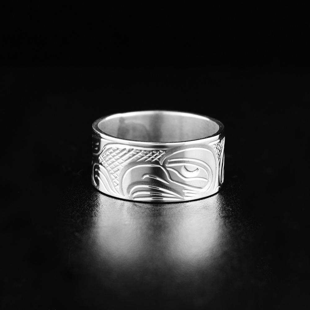This Heavy gauge Eagle ring is made from sterling silver and has a wide band. There is a depiction of the Eagle carved into the surface of the band.