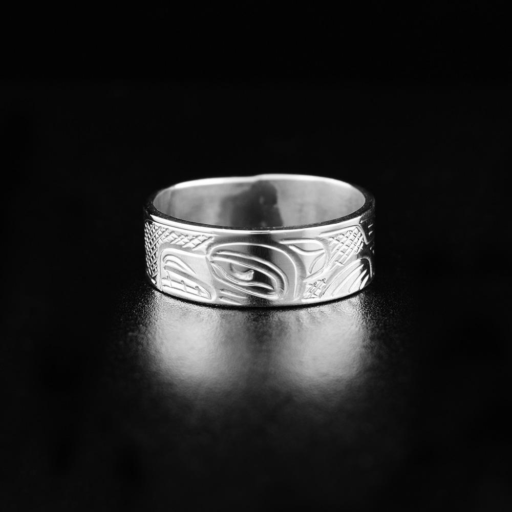 This heavy gauge sterling silver ring has a single band with a depiction of the Bear carved into the surface of it.