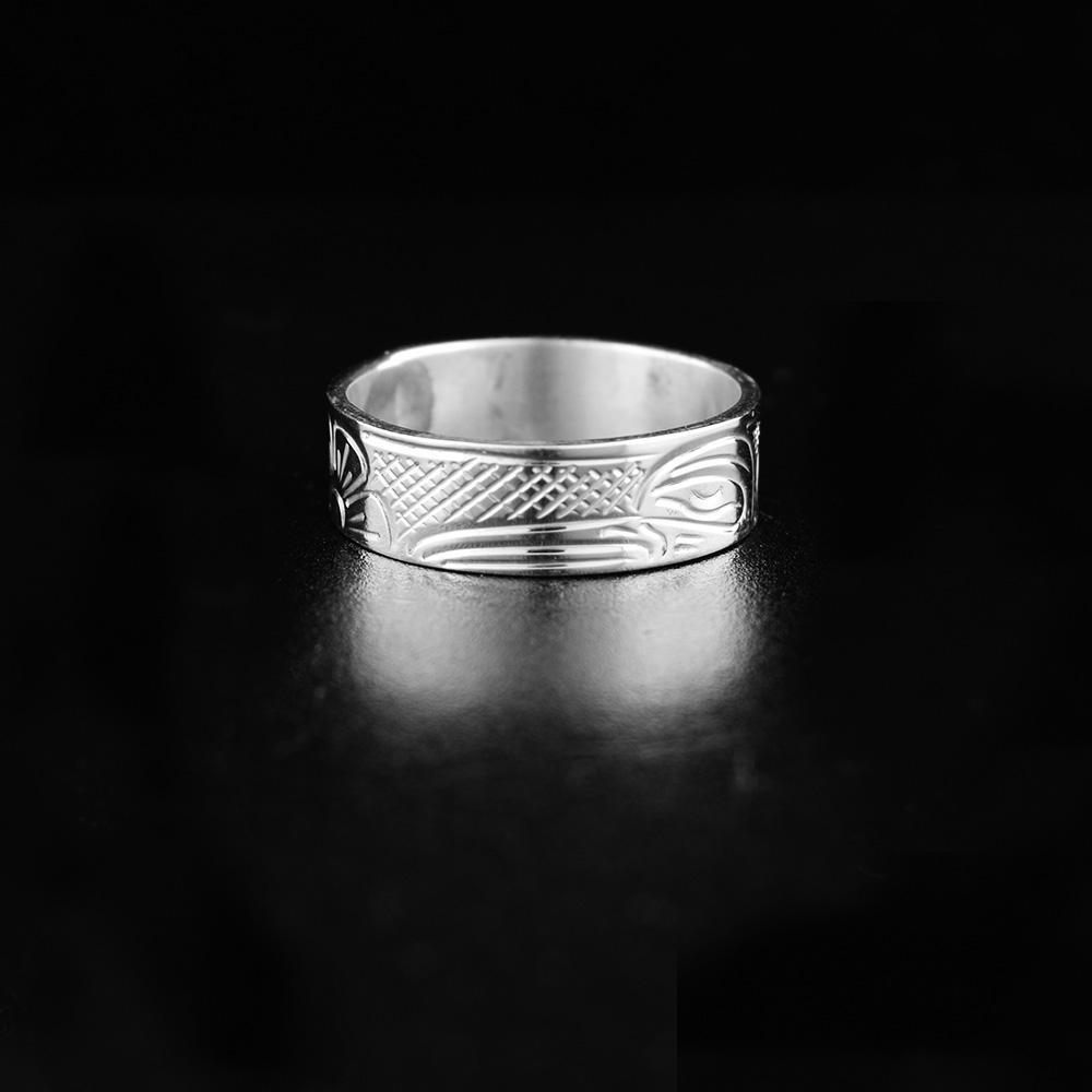 This Hummingbird ring is made from sterling silver and has a single band with a depiction of the Hummingbird carved into the surface of it.