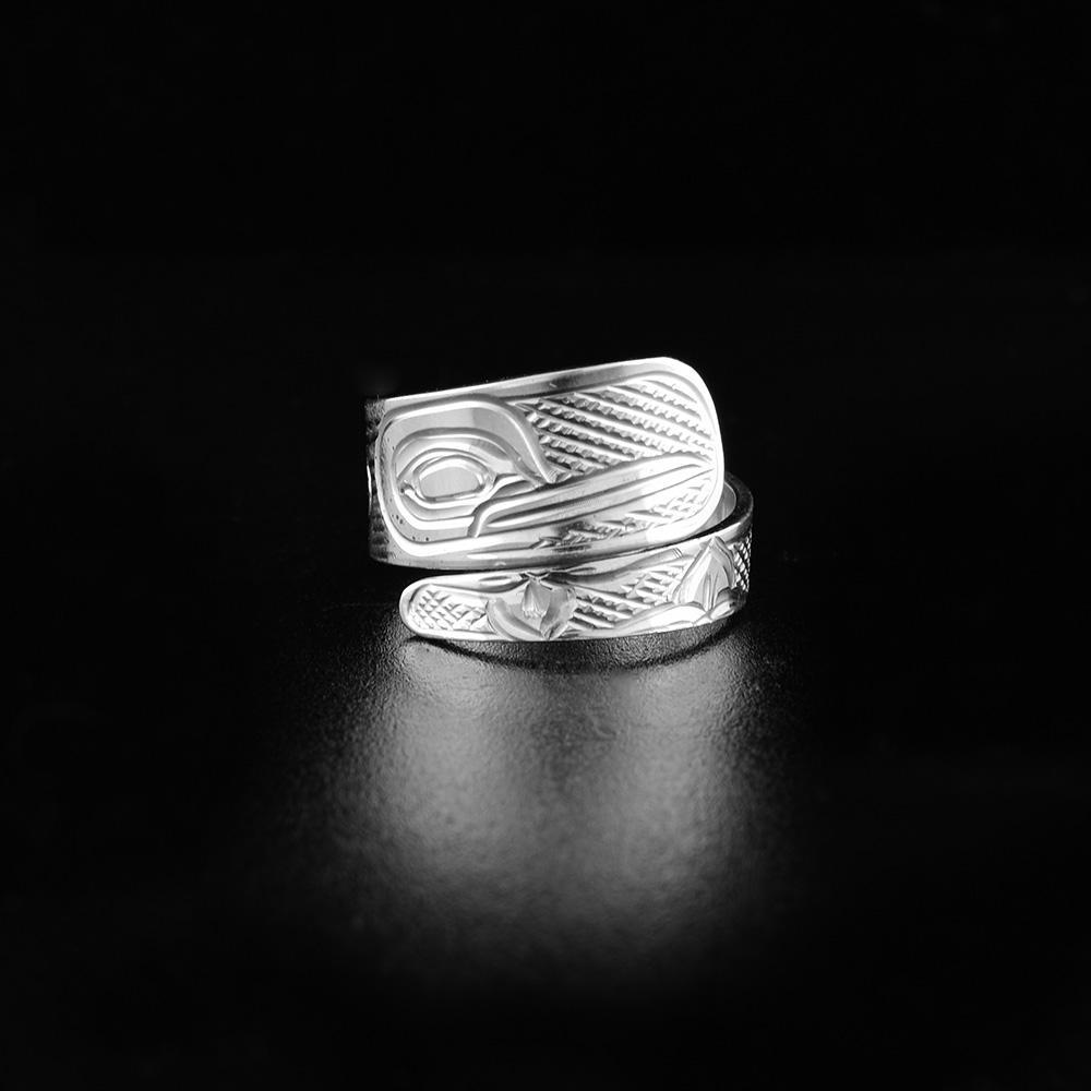 This Hummingbird ring is made from sterling silver and it has a tapered band that wraps around the finger twice. There is a depiction of the Hummingbird carved into the surface of the band.