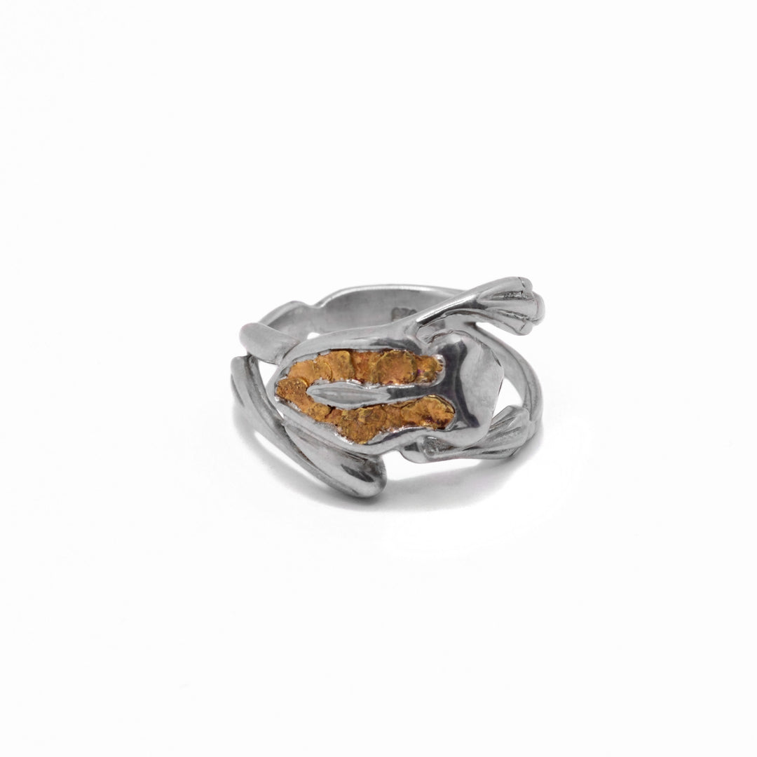 22K Nugget Frog Ring by Tom Gregorczyk. The design depicts a frog mid-jump with both arms and legs stretched out with 22K gold nuggets on the frog's back in a U-shape.