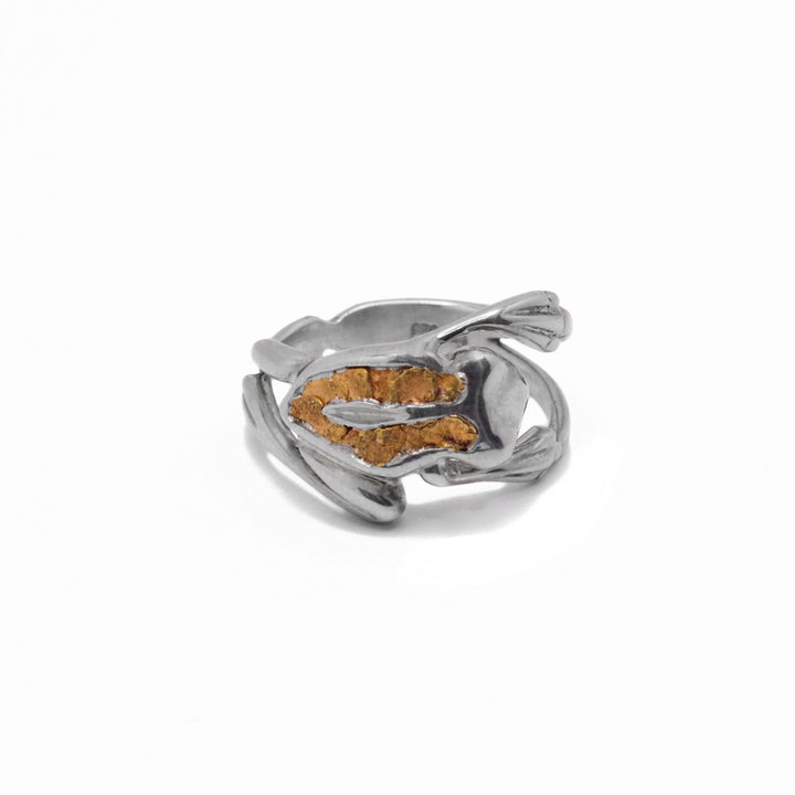 22K Nugget Frog Ring by Tom Gregorczyk. The design depicts a frog mid-jump with both arms and legs stretched out with 22K gold nuggets on the frog's back in a U-shape.