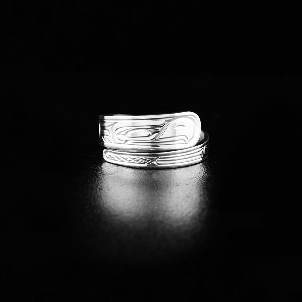 This sterling silver wrap ring has a tapered band that wraps around the finger twice. There is a depiction of the Eagle carved into the surface of the band.