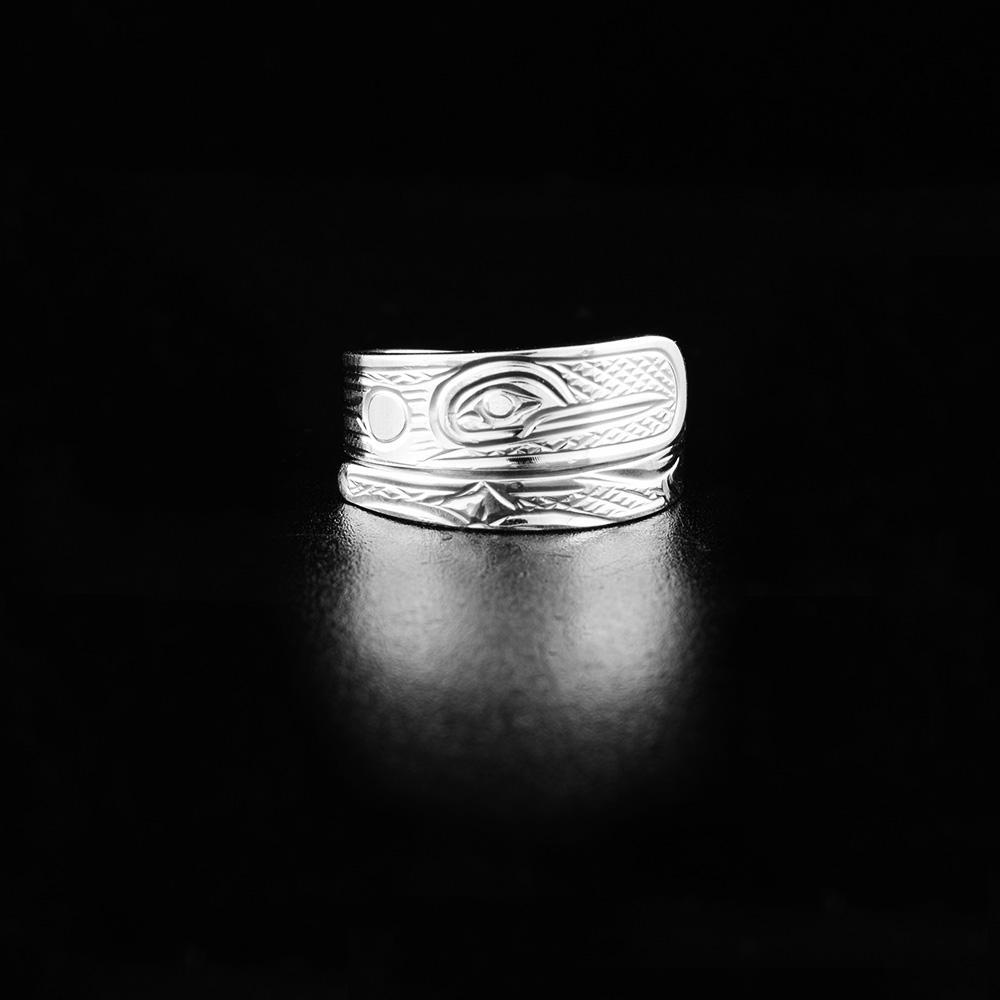 This Hummingbird ring is made from sterling silver and has a tapered band that wraps around the finger twice. There is a depiction of the Hummingbird carved into the surface of the band.
