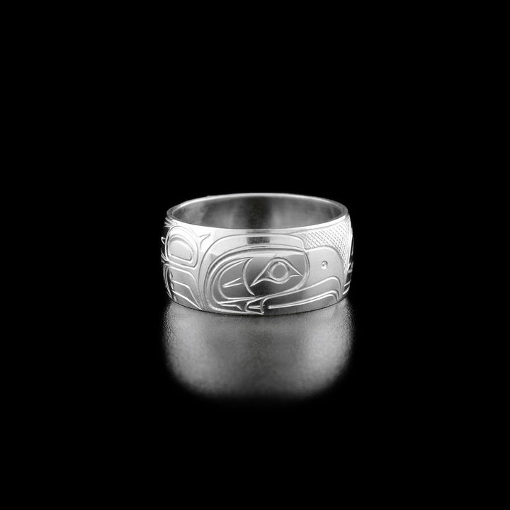 Left angle photo of the ring shows carved designs representing the wings and talons of the eagle.