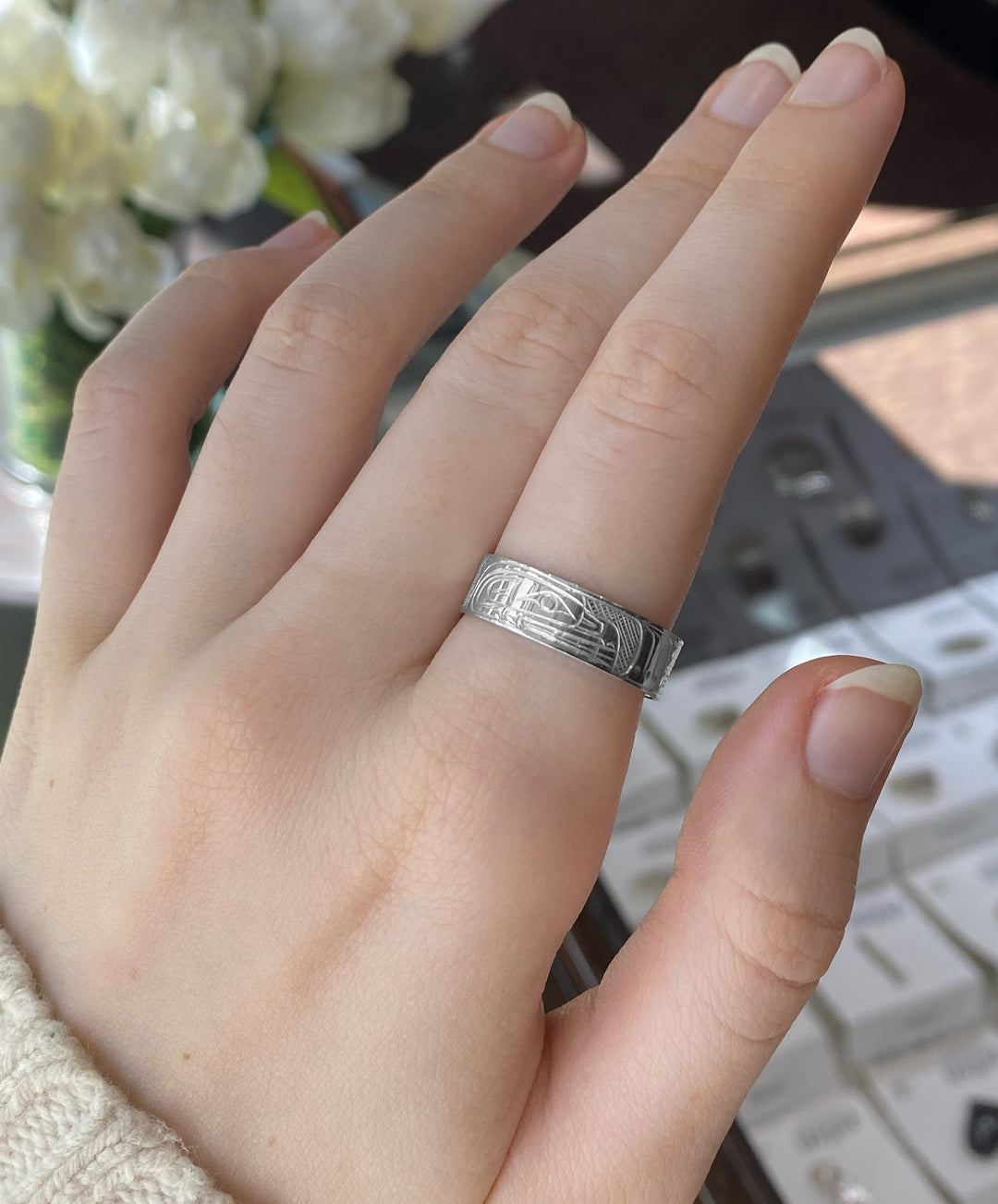 Bear ring on an index finger.