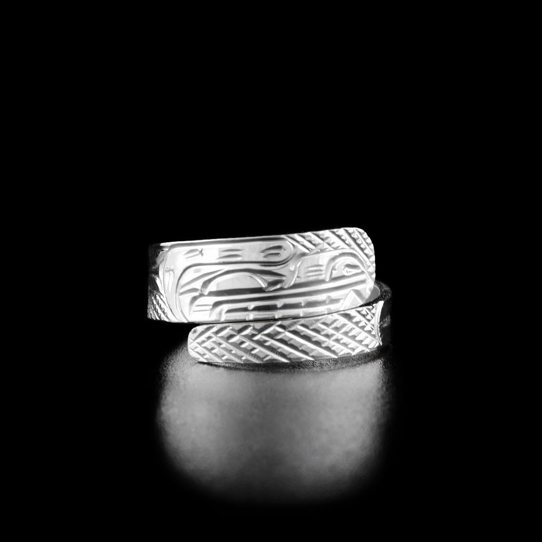 This sterling silver wrap ring has a tapered band that wraps around the finger twice. There is a depiction of the Bear carved into the surface of the band.