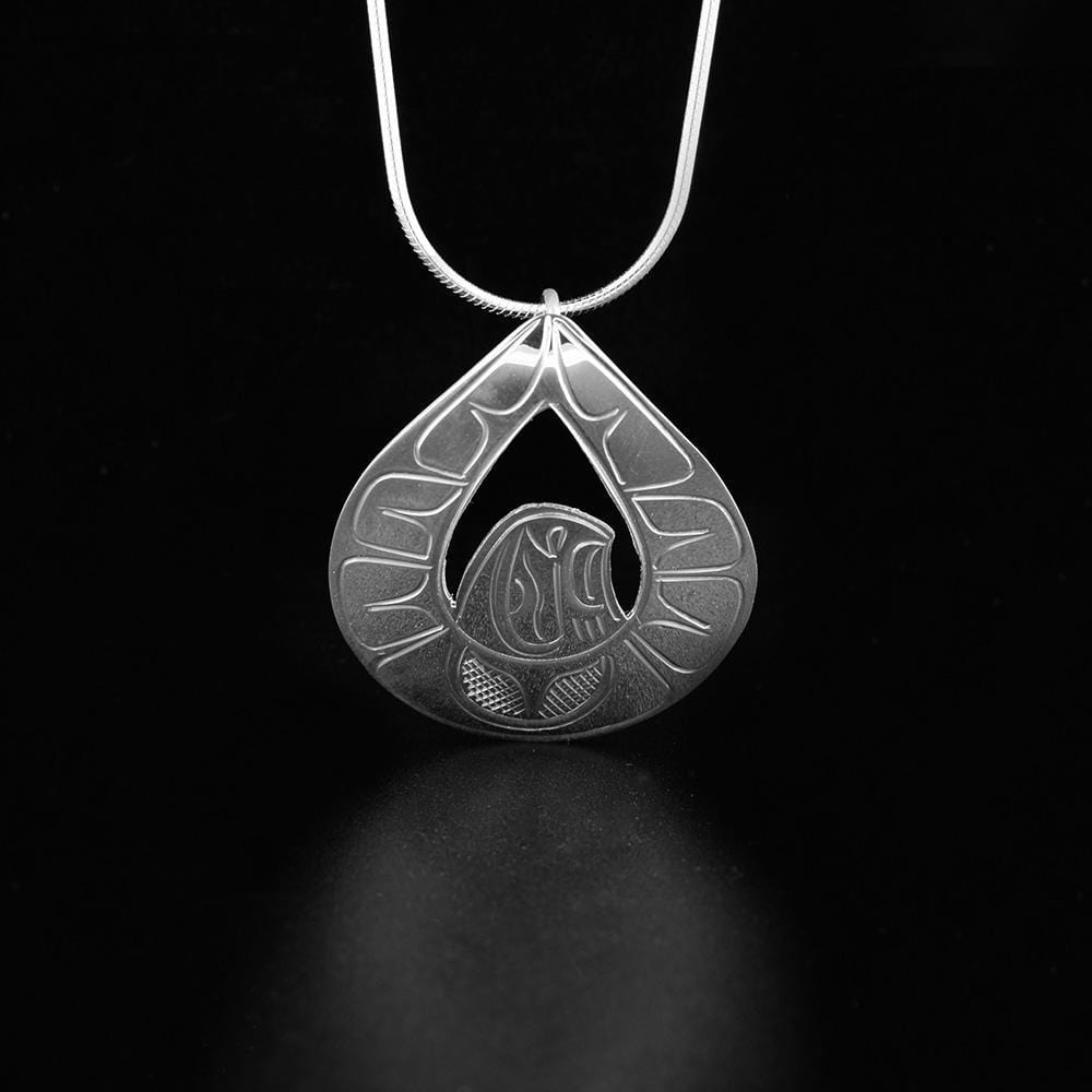 This sterling silver Eagle pendant is teardrop shaped and has a depiction of the Eagle with its wings held out. There are carvings on the surface of the pendant depicting the soaring Eagle.