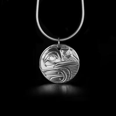 This Round Sterling Silver Hummingbird Pendant is handmade by Kwakwaka'wakw artist Victoria Harper. She has used sterling silver for this piece. The pendant measures 0.91" x 0.75". The chain is not included. The Hummingbird Legend Represents: BEAUTY, LOVE, HARMONY.