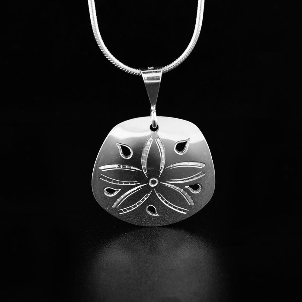 This sterling silver, sand dollar pendant has a circle shape with cutout designs and carvings on the surface of it depicting the sand dollar.