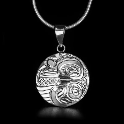 This Small Round Hummingbird Pendant is handmade by Kwakwaka’wakw artist Carrie Matilpi. She has used sterling silver to create this piece. The pendant measures 1.14" x 0.75". The chain is not included. The Hummingbird Legend Represents: BEAUTY, LOVE, HARMONY.