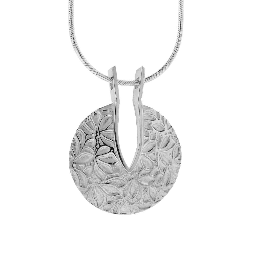 This sterling silver flower pendant has a circle shaped pendant with textured patterns of flowers all over the pendant.