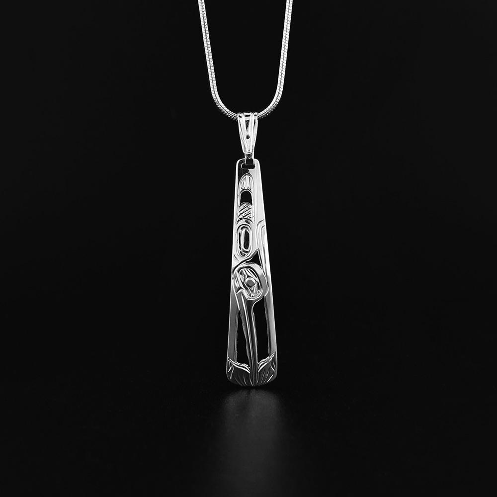 This Hummingbird pendant is made from sterling silver and has a long, tapered pendant. There are cutouts and carvings that depict the Hummingbird.
