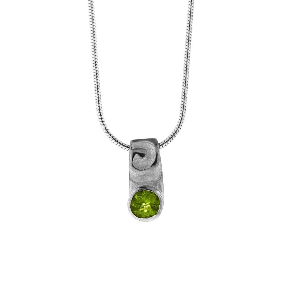 This peridot pendant necklace is made from sterling silver and peridot gemstone. There is a swirly design above the gemstone which is faceted in the bottom of the pendant.