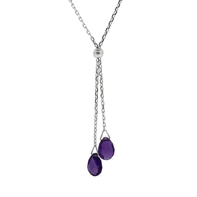 This Amethyst Lantern Lariat Necklace is hand crafted by artist Pamela Lauz. The necklace is made from sterling silver with two faceted amethysts hanging down together.  The necklace is approximately 18" long, and the lariat hangs down an additional 1.75" (4.7cm).