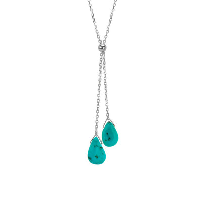 This Turquoise Lantern Lariat Necklace is hand crafted by artist Pamela Lauz. The necklace is made from sterling silver with two turquoise drops hanging down together.  The necklace measures 16" long and the lariat hangs down 2.5" (6cm).