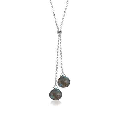 This Labradorite Lantern Lariat Necklace is hand crafted by artist Pamela Lauz. The necklace is made from sterling silver with two labradorite drops hanging down together.  The necklace measures 17" and the lariat hangs down 2.1" (5.5cm).