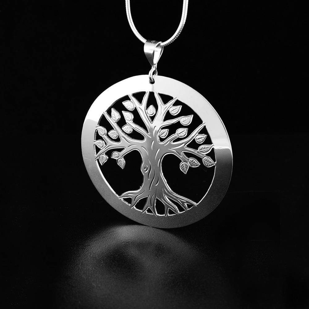 This beautiful tree of life pendant is made from sterling silver and has a large, circle shape. There are cutout designs and carvings on the surface of the pendant that depict the tree of life.