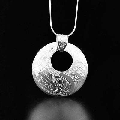 round cut out large silver bear pendant with a carved bail
