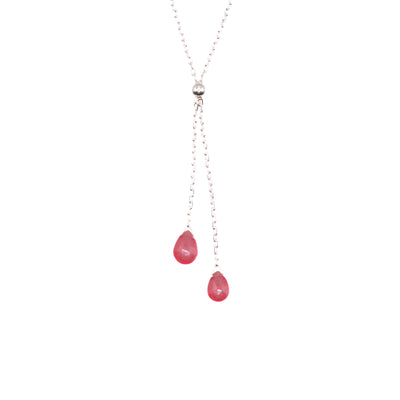 This Ruby Lantern Lariat Necklace is hand crafted by artist Pamela Lauz. The necklace is made from sterling silver with two ruby drops hanging down together.  The necklace measures 17" and the lariat hangs down 2" (5cm).