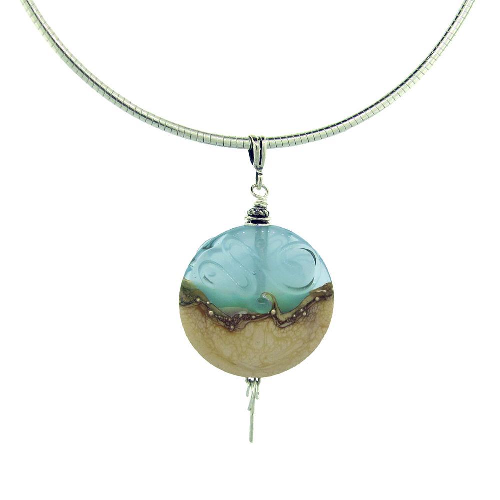 This glass bead necklace is made from lamp worked glass and sterling silver. The glass pendant is circle shaped and depicts the sea.