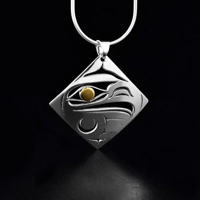 sterling silver and 18K gold diamond shaped pierced raven pendant