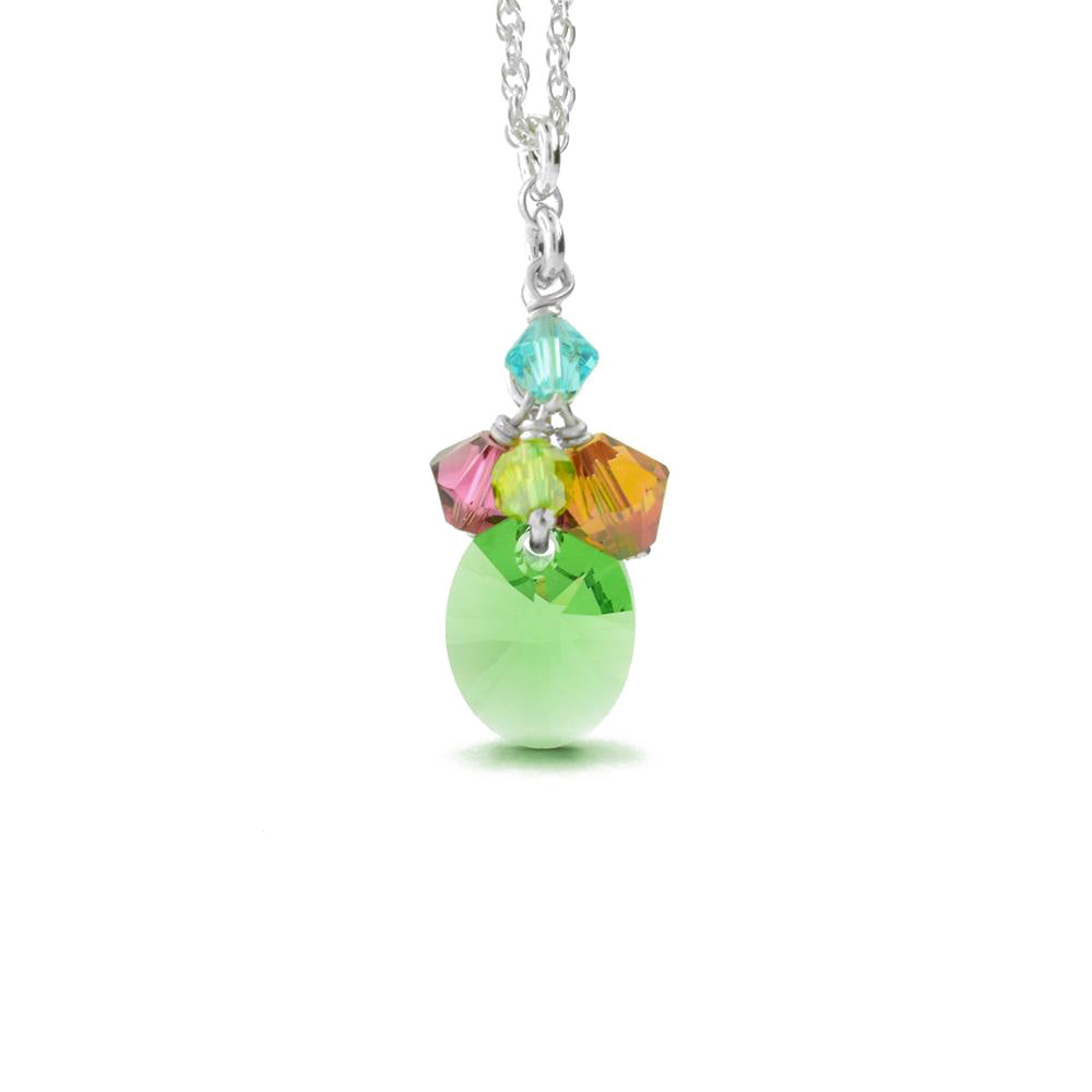This Petite Cluster Green Swarovski Crystal Necklace is handmade by artist Karley Smith. The pendant is made up of Swarovski crystals and sterling silver. It comes with the sterling silver rope chain.  The pendant is 1" long. The rope chain is 16" long with a 2" extender.