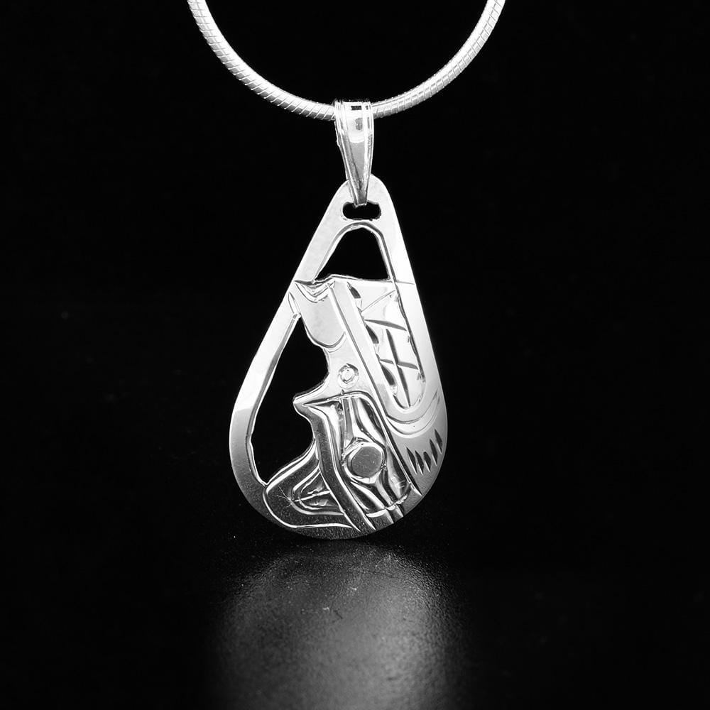 This Wolf pendant is made from sterling silver and has a teardrop shape. There are cutout designs and designs on the surface of the pendant depicting the Wolf.