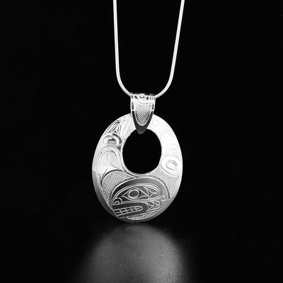 Sterling Silver oval cut out orca pendant with a carved bail
