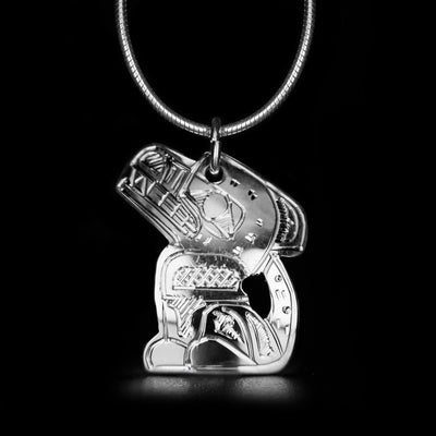 This Wolf Shaped Pendant is handmade by Coast Salish artist, Gilbert Pat. He has used sterling silver to create this piece. The pendant measures approximately 1.0" x 0.8". The chain is not included. The Wolf Legend Represents: LOYALTY, TEACHER, COOPERATION.