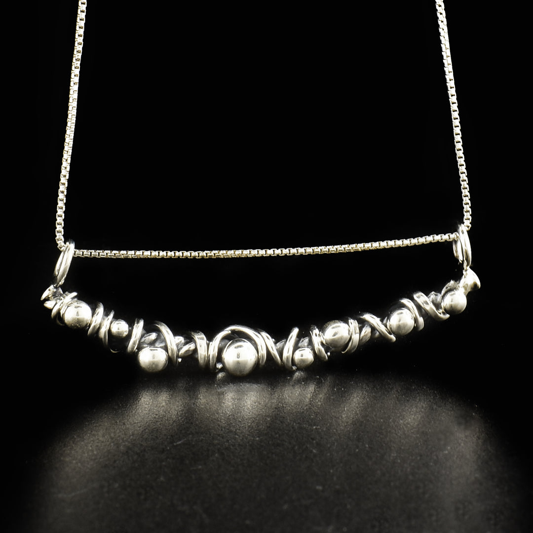 Sterling Silver Bud and Vine Necklace is handcrafted by Joy Annett.