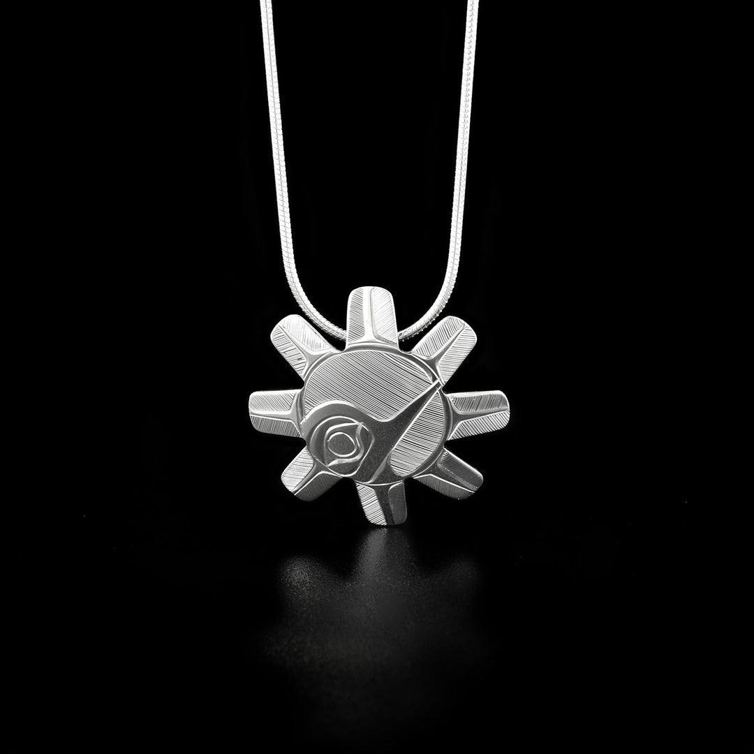 This unique Hummingbird and Sun pendant is made from sterling silver and is shaped like the Sun and has 8 "rays" extending from the round center. There are gorgeous carvings on the surface of the pendant depicting the Hummingbird.