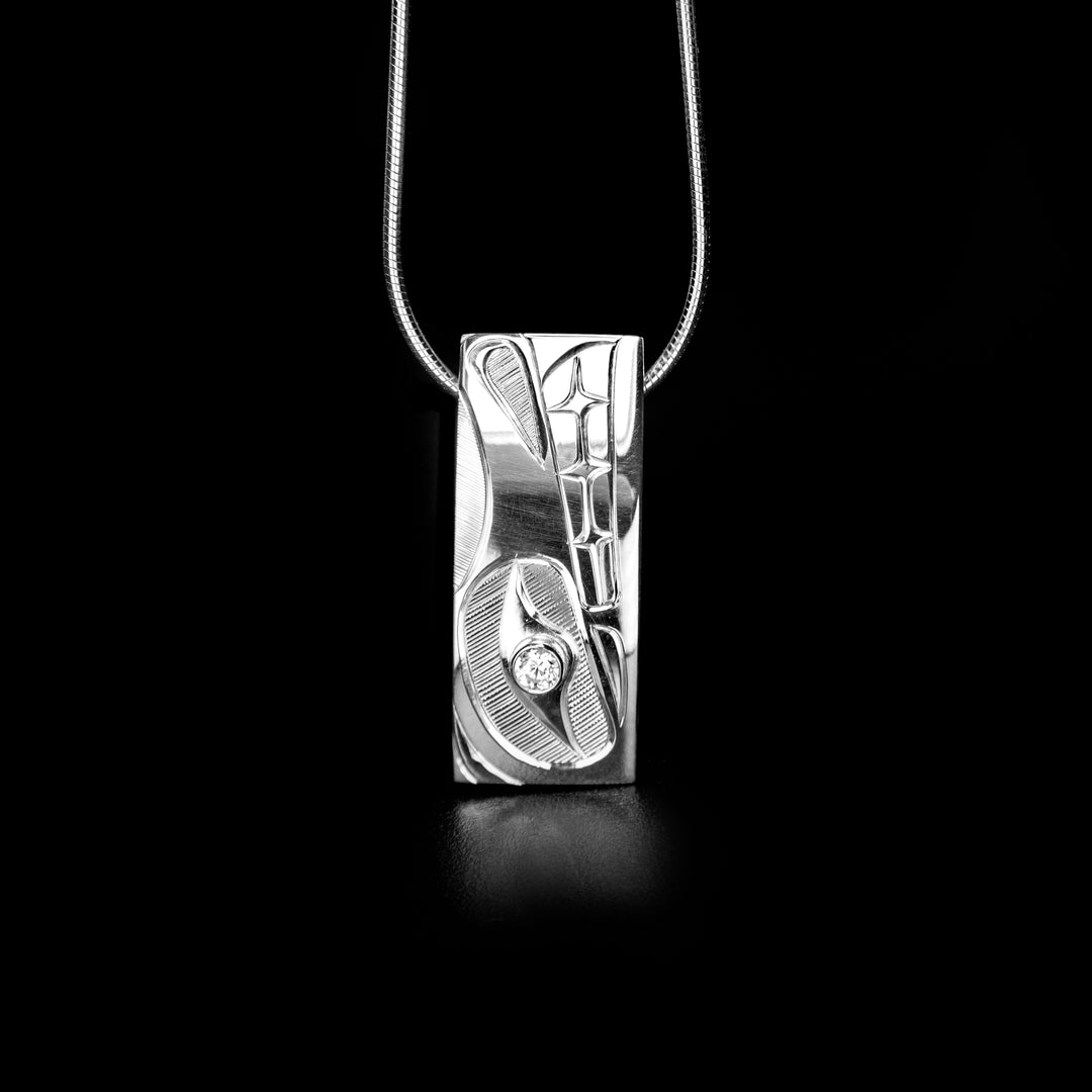 Rectangular Wolf Pendant with Cubic Zirconia hand-carved by Haisla artist Hollie Bartlett.