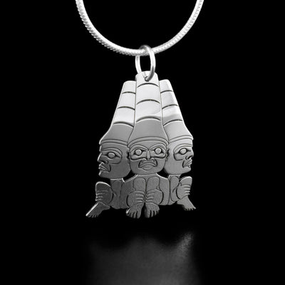 Sterling Silver Mini Watchmen Pendant by Grant Pauls. The design depicts 3 watchmen with their legs tucked in and large hats. One watchman is facing the left, one forward, and one to the right.