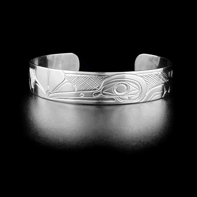 Hummingbird bracelet hand-carved by Kwakwaka'wakw artist Don Lancaster. Made of sterling silver. Bracelet is 6.15" long with 1" gap and has width of 0.50".