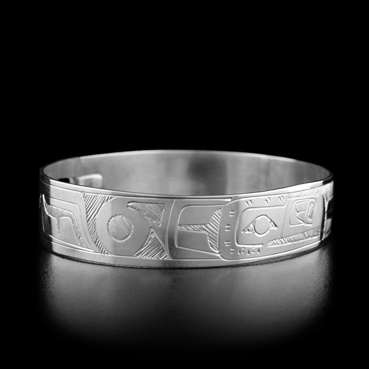 Left angle photo of the bracelet shows a large feather on the thunderbird's head and its spread wing.