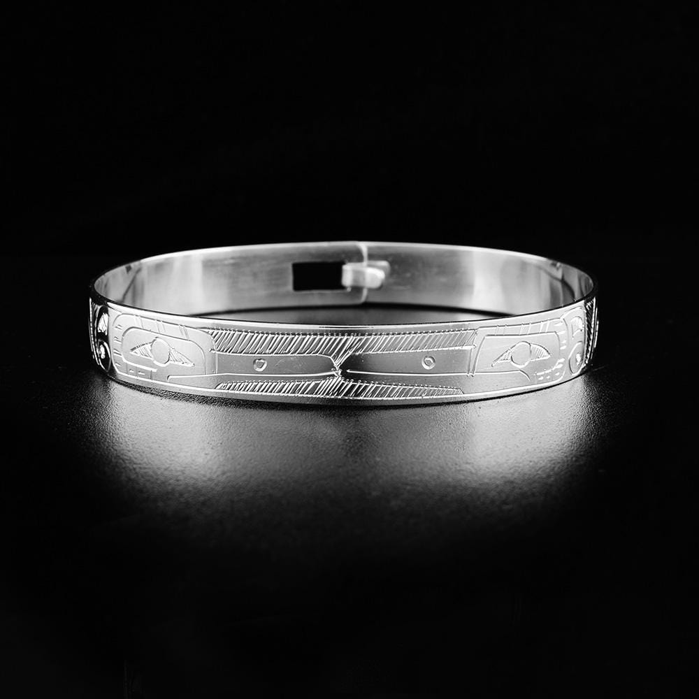 These sterling silver bangle bracelets have a single band with a clasp in the back. There are two depictions of the Hummingbird carved into the surface of the band.