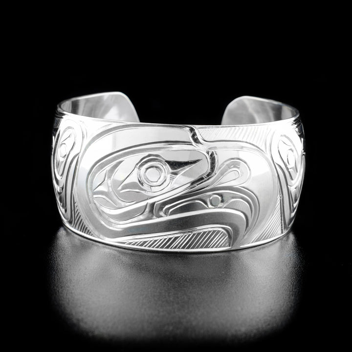This Eagle bracelet is made from sterling silver and have a single, wide band with a gap in the back. There is a depiction of the Eagle that has been hand crafted into the surface of this cuff bracelet.