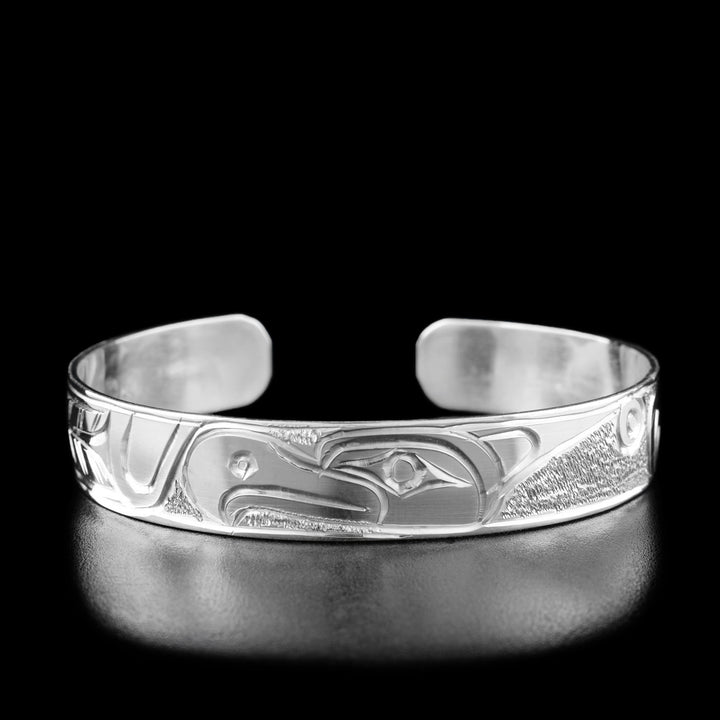 The center of this thunderbird bracelet has the profile of a thunderbird's head facing the left.
