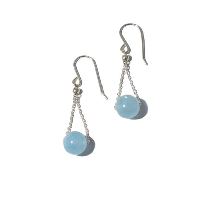 These Aquamarine Chandelier Earrings are handmade by artist Pamela Lauz.  She has used sterling silver and aquamarine to create them.  Each earring measures 1.55" x 0.40" from the top of the hook.