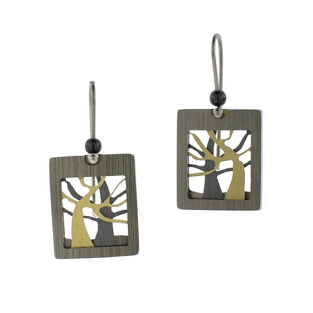 These dangling tree earrings are made from brushed aluminium, anodized aluminium and stainless steel. The hangs are rectangular and have a cutout design of trees and the hooks are made from stainless steel.