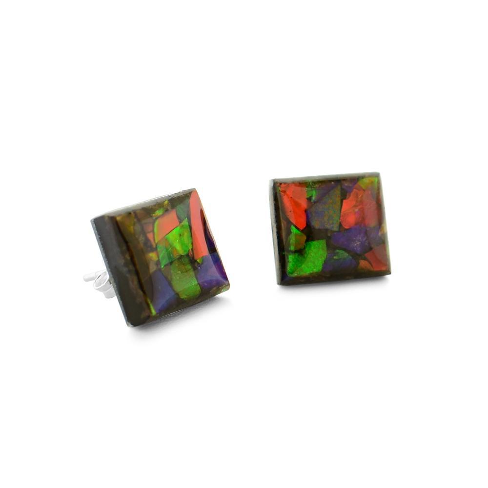 These ammolite stud earrings are made with sterling silver and pieces of ammolite gemstone. The gems are cast into a square shape and then mounted onto sterling silver rods.