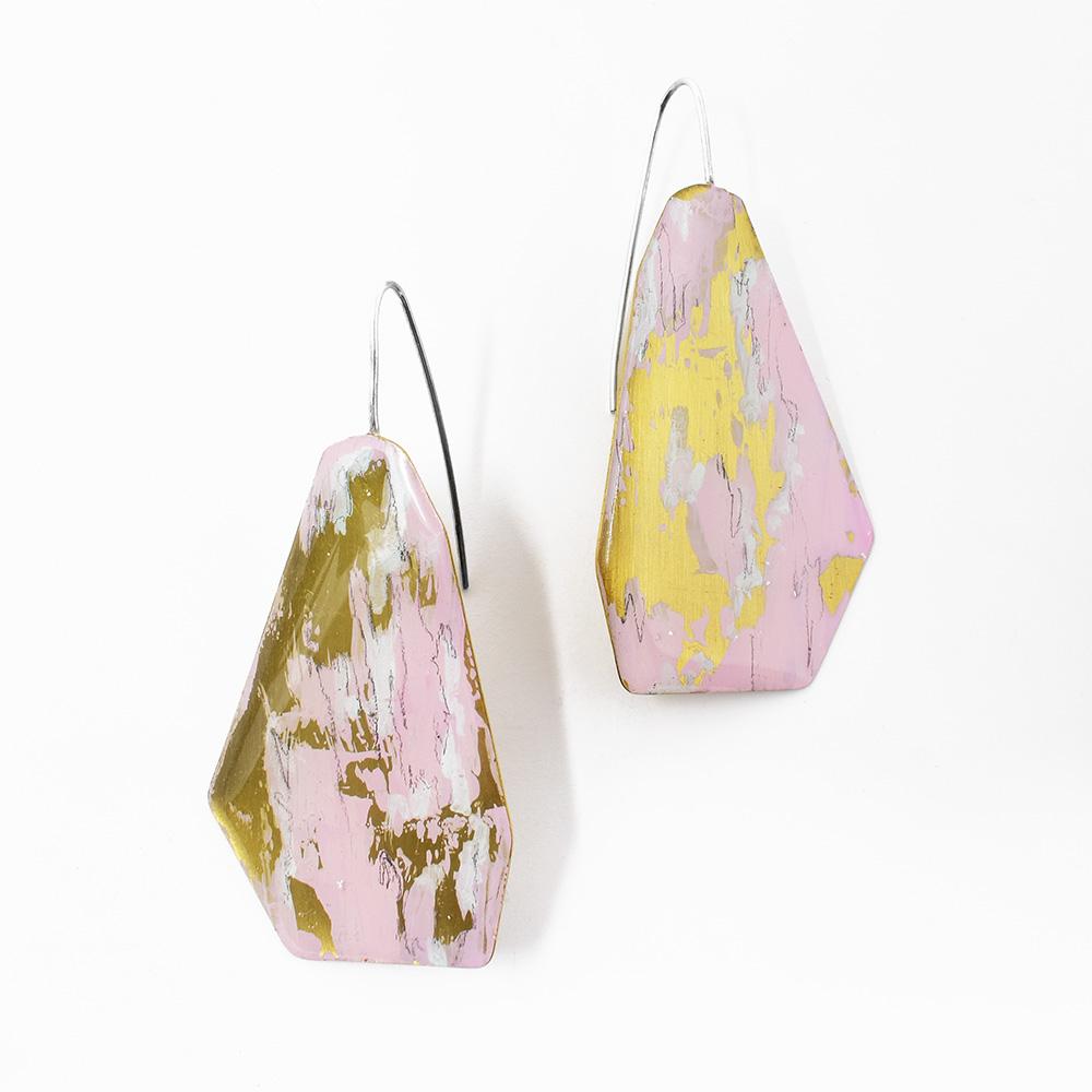 These unique pink earrings are made from gold foil, brass and soy based pink paint. There are diamond shaped sections attached to the hooks that are pink with gold foil.