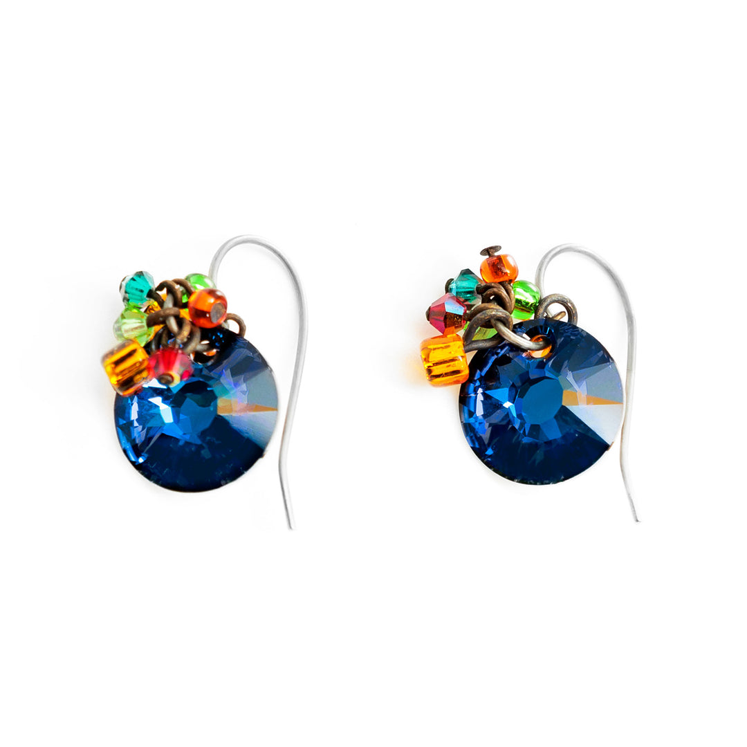 These crystal cluster earrings have been made using circle shaped Bermuda blue Swarovski crystals beautifully cut and colorful glass beads. There are cluster of the glass beads held above the Swarovski crystals on these unique dangle earrings.