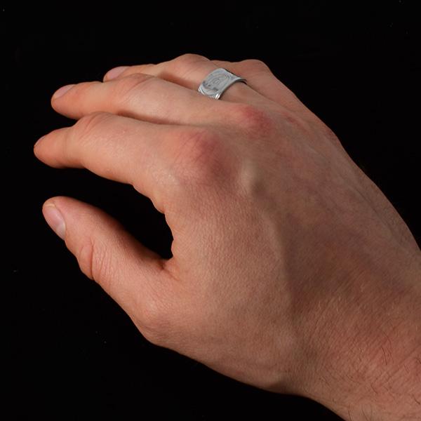 3/8" Sterling Silver Heavy Gauge Wolf RingThis sterling silver Wolf ring has a wide, heavy gauge band with a depiction of the Wolf carved into the surface of it.